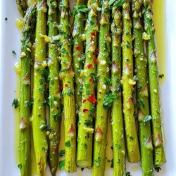 To make this tasty dish, gather these key items: - 1 pound fresh asparagus, trimmed - 3 cloves garlic, minced - 2 tablespoons olive oil - Zest and juice of 1 lemon - 1 teaspoon sea salt - 1/2 teaspoon black pepper You can add a few optional items for more taste: - 1/4 teaspoon red pepper flakes (for heat) - Fresh parsley, chopped (for garnish) This dish is not just tasty; it’s healthy too. Here are some key facts: - Calories: About 100 per serving - Protein: 3 grams - Fat: 7 grams - Carbohydrates: 8 grams - Fiber: 4 grams - Vitamin A: 20% of daily value - Vitamin C: 15% of daily value Lemon garlic roasted asparagus is a great way to enjoy healthy veggies. Try the full recipe for a delightful meal! To start, gather your ingredients. You will need: - 1 pound fresh asparagus, trimmed - 3 cloves garlic, minced - 2 tablespoons olive oil - Zest and juice of 1 lemon - 1 teaspoon sea salt - 1/2 teaspoon black pepper - 1/4 teaspoon red pepper flakes (optional for heat) - Fresh parsley, chopped (for garnish) Trim the tough ends off the asparagus. This makes them tender and easy to eat. Mince the garlic finely. The more you mince, the stronger the flavor. Zest the lemon first, then cut it in half to juice it later. Now, let’s get cooking! Preheat your oven to 425°F (220°C). In a large bowl, mix the minced garlic, olive oil, lemon zest, lemon juice, sea salt, black pepper, and red pepper flakes. Stir well to combine. Add the trimmed asparagus to the bowl. Toss until the asparagus is fully coated in your tasty marinade. This step is key! Next, spread the asparagus out in a single layer on a baking sheet lined with parchment paper. This helps it roast evenly. Roast the asparagus for 15-20 minutes, turning them halfway. You want them to be tender yet slightly crispy. When done, remove from the oven and let them cool for a minute. Transfer to a serving dish and drizzle any leftover marinade on top. Garnish with fresh parsley before serving. For the best results, choose thick and vibrant asparagus. Thin stalks may cook too quickly. Always preheat your oven. This ensures even cooking and great texture. Avoid crowding the baking sheet. This allows hot air to circulate around the asparagus, giving it a nice roast. If you want more flavor, try adding lemon slices on top. They create a bright, zesty taste. Remember, roasting time may vary based on the size of your asparagus. Keep an eye on them as they roast. Enjoy this flavorful veggie dish as a side or a light main dish! For the full recipe, check the link again. To get the best asparagus, look for bright green stalks. They should be firm and straight. The tips should be closed and tight. Avoid asparagus with limp stalks or yellowing tips. Freshness is key for great flavor. If you can, buy local and seasonal asparagus for the best taste. The lemon and garlic make this dish shine. Use fresh garlic for a strong punch. Minced garlic mixes well with olive oil and lemon juice. Zest the lemon before juicing, as this adds an extra burst of flavor. Balance the acidity of the lemon with a pinch of sea salt. You can also add red pepper flakes for a spicy kick. One mistake is overcrowding the baking sheet. Give the asparagus space to roast evenly. If they are too close, they will steam instead of roast. Another mistake is not preheating the oven. A hot oven helps achieve that perfect crispy texture. Finally, don’t skip the resting time after roasting. This allows flavors to settle before serving. For the complete recipe, check out the Full Recipe. {{image_2}} You can mix in other vegetables with your asparagus. Carrots and bell peppers work great. Slice them thinly for even cooking. Broccoli florets also add a nice crunch. Just remember to adjust the cooking time. Some veggies may roast faster than asparagus. Keep an eye on them to avoid burning. Feel free to play with seasonings and herbs. Try adding thyme or oregano for a new twist. A sprinkle of Parmesan cheese can give it a savory kick. If you love heat, add more red pepper flakes. For a fresh touch, squeeze extra lemon juice before serving. These changes can elevate the flavor in fun ways. Lemon garlic roasted asparagus pairs well with many dishes. Serve it as a side for grilled chicken or fish. It also complements pasta dishes nicely. You can even toss it into a salad for extra crunch. Drizzle with balsamic glaze for a sweet finish. The options are endless, making this veggie dish versatile and exciting. For the complete guide, check the Full Recipe. After you enjoy your lemon garlic roasted asparagus, store any leftovers in an airtight container. This keeps the asparagus fresh and tasty. Place the container in the fridge. It will stay good for about 3 to 4 days. Make sure the container seals well to avoid moisture loss and keep the flavors intact. To reheat the asparagus, preheat your oven to 350°F (175°C). Spread the asparagus on a baking sheet. Heat for about 10 minutes or until warm. You can also use a microwave if you're in a hurry. Place the asparagus on a microwave-safe plate and cover it with a damp paper towel. Heat it for about 30 seconds at a time until warm. You can freeze roasted asparagus, but it changes the texture. First, let it cool completely. Then, place the asparagus in a freezer bag, removing as much air as possible. It will last in the freezer for up to three months. When you're ready to eat, thaw it overnight in the fridge. Reheat it in the oven or microwave for best results. For more tips, check the Full Recipe. Roasting asparagus takes about 15 to 20 minutes. The time may vary based on the thickness of the stalks. I suggest checking for tenderness after 15 minutes. You want them tender yet slightly crispy. This gives them a great texture. Yes, you can use frozen asparagus. However, fresh asparagus tastes better. If you use frozen, thaw them first. Pat them dry with a towel before marinating. This helps to prevent sogginess during roasting. Lemon Garlic Roasted Asparagus goes well with many dishes. Try it with grilled chicken or fish. It also complements pasta dishes nicely. You can serve it alongside a fresh salad for a light meal. The bright flavors enhance any dish. Yes, this recipe is vegan-friendly. It contains no animal products. The ingredients are all plant-based, making it perfect for vegans. You can enjoy it alongside other vegan dishes for a wholesome meal. For the full recipe, check out the detailed instructions. Lemon garlic roasted asparagus is easy to make and packed with taste. We covered the key ingredients, step-by-step cooking, and helpful tips. You can enhance the dish by adding more veggies or changing spices. Proper storage keeps leftovers fresh for later meals. Remember these details to avoid common mistakes. Now, you’re ready to impress friends and family with this simple, healthy side dish. Enjoy your cooking and explore new ways to savor asparagus!