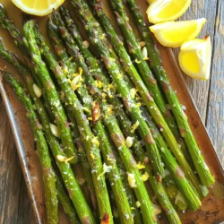 - 1 lb fresh asparagus, trimmed - 3 tablespoons olive oil - 4 cloves garlic, minced - Zest of 1 lemon - 2 tablespoons fresh lemon juice - 1 teaspoon sea salt - ½ teaspoon black pepper - 1 teaspoon red pepper flakes (optional, for added heat) - 2 tablespoons grated Parmesan cheese (optional, for serving) - Lemon wedges for serving Asparagus is more than just a tasty veggie. It is packed with vitamins A, C, E, and K. It also has fiber, which helps digestion. Asparagus is low in calories but high in nutrients. These nutrients can boost your health and help keep your body strong. Plus, it contains antioxidants that fight damage from free radicals. You can find fresh asparagus at grocery stores or farmers' markets. Look for vibrant green stalks with tight tips. If you want, try organic asparagus for a fresh taste. You can swap olive oil for avocado oil if you like. If you do not have garlic, shallots can work too. For a twist, try adding different herbs or spices, like thyme or chili powder. Start by gathering your ingredients. You will need: - 1 lb fresh asparagus, trimmed - 3 tablespoons olive oil - 4 cloves garlic, minced - Zest of 1 lemon - 2 tablespoons fresh lemon juice - 1 teaspoon sea salt - ½ teaspoon black pepper - 1 teaspoon red pepper flakes (optional) - 2 tablespoons grated Parmesan cheese (optional) - Lemon wedges for serving Next, preheat your oven to 425°F (220°C). This high heat helps the asparagus roast perfectly. While the oven heats, wash and trim the asparagus. Snap off the woody ends; they will break naturally at the right point. In a mixing bowl, combine olive oil, minced garlic, lemon zest, lemon juice, sea salt, and black pepper. If you like some heat, add red pepper flakes. Whisk this mixture until well blended. This dressing brings bright flavors to your dish. Place the trimmed asparagus on a baking sheet. Drizzle the lemon garlic mixture over the asparagus. Use your hands to toss them gently, ensuring they are coated evenly. Spread the asparagus in a single layer. This allows them to roast evenly and get crispy. Roast the asparagus in the preheated oven for 12-15 minutes. Keep an eye on them; they should become tender with slightly crispy tips. If you like, sprinkle grated Parmesan cheese over the hot asparagus right after you take them out of the oven. This adds a nice salty flavor. To ensure even roasting, here are some tips: - Make sure the asparagus is in a single layer on the baking sheet. Crowding them can cause steaming instead of roasting. - Use a large enough baking sheet. If you have too much asparagus, use two sheets. - Rotate the baking sheet halfway through cooking. This helps brown the asparagus more evenly. Following these steps gives you perfect Lemon Garlic Roasted Asparagus every time. For the full recipe, check out the complete instructions above. For lemon garlic roasted asparagus, simple is best. I love using olive oil, fresh garlic, and lemon. You can add sea salt and black pepper for flavor. If you want some heat, a sprinkle of red pepper flakes works well. For a twist, try fresh herbs like thyme or rosemary. These add depth and aroma, making each bite a treat. When picking asparagus, look for bright green stalks. They should feel firm and crisp. Avoid any that are limp or wilted. The tips should be closed and compact. Thinner stalks are tender and sweet, while thicker ones have a stronger taste. It’s all about your preference. Fresh asparagus is key to great flavor in your dish. One common mistake is overcooking the asparagus. It should be tender but still crisp. Roasting for 12-15 minutes usually works well. Another mistake is not spacing the asparagus on the baking sheet. They need room to roast evenly. Lastly, don’t skip the lemon juice! It brightens the dish and makes the flavors come alive. For the full recipe, check out the Zesty Lemon Garlic Roasted Asparagus. {{image_2}} You can change the flavor of Lemon Garlic Roasted Asparagus easily. Adding fresh herbs like thyme or rosemary gives it a new twist. Just chop a tablespoon of your chosen herb and mix it in with the lemon-garlic sauce before you toss the asparagus. The herbs will add depth and aroma. You can also try adding a splash of balsamic vinegar or a sprinkle of smoked paprika for a unique taste. These small changes can make a big difference in flavor. While roasting is great, you can also grill asparagus for a smoky flavor. Preheat your grill to medium heat. Toss the asparagus with the lemon-garlic mix just as you would for roasting. Place the asparagus on the grill and cook for about 6-8 minutes. Turn them often to ensure even cooking. Grilling gives the asparagus a nice char and enhances the taste. You can also sauté the asparagus in a pan for a quick dish. Just use the same lemon-garlic mixture. For a vegan version, skip the Parmesan cheese. The dish still tastes amazing without it. If you want some creaminess, try using nutritional yeast. It adds a cheesy flavor without any dairy. You can also add some toasted nuts like almonds or pine nuts for crunch. They not only add texture but also a nutty flavor. These options ensure everyone can enjoy the delicious Lemon Garlic Roasted Asparagus. Check out the Full Recipe for more tips on how to make this dish shine! After your tasty lemon garlic roasted asparagus, you might have some left. To keep it fresh, place it in an airtight container. Store it in the fridge for up to three days. This helps maintain its flavor and crunch. If you want to eat it later, you can also wrap it tightly in plastic wrap. You can freeze asparagus, but it needs a little prep first. Blanch the asparagus in boiling water for about two minutes. Then, quickly cool it in ice water. Once cooled, pat it dry and place it in a freezer bag. Remove as much air as you can. Frozen asparagus can last for up to six months. When ready to use, you can add it straight to your dishes. To enjoy your leftover lemon garlic roasted asparagus, reheat it in the oven. Preheat the oven to 350°F (175°C). Place the asparagus on a baking sheet and cover it with foil. Heat for about 10 minutes or until warm. You can also microwave it, but be careful not to overcook it. Just heat for 30 seconds at a time until warm. Enjoy the flavors from the Full Recipe again! Roasting asparagus takes about 12 to 15 minutes. It cooks at 425°F (220°C). You want it tender but still crisp. Check for doneness by looking at the tips. They should be slightly crispy. If you like it softer, leave it in a bit longer. Yes, you can use frozen asparagus. However, thaw it first. Pat it dry with a towel to remove excess moisture. This helps it roast better and prevents sogginess. Keep in mind that frozen asparagus cooks faster. Start checking it around 8 minutes. Lemon garlic roasted asparagus pairs well with many dishes. Try it with grilled chicken or fish for a fresh meal. It also goes great with pasta or rice. For a vegetarian option, serve it with quinoa or a hearty salad. This dish adds color and flavor to any plate. Check out the full recipe for more ideas! In this article, we explored the many ways to enjoy asparagus. We covered the best ingredients, their health benefits, and how to prepare asparagus with ease. You learned cooking tips, seasoning ideas, and common mistakes to avoid. We also highlighted variations for flavor and dietary needs. Proper storage and reheating ensure nothing goes to waste. Remember, cooking should be fun and tasty, so feel free to experiment. Enjoy your delicious asparagus dishes!
