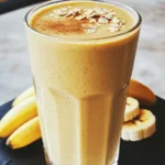 - 1 frozen banana - 1 cup unsweetened almond milk - 1 scoop vanilla protein powder - 1/2 teaspoon ground cinnamon - 1 tablespoon maple syrup - 2 tablespoons rolled oats - 1 tablespoon Greek yogurt (or dairy-free alternative) - 1/2 teaspoon vanilla extract - Ice cubes (optional) The main ingredients for the Cinnamon Roll Protein Smoothie are simple and healthy. Each one plays a key role in taste and nutrition. The frozen banana gives the smoothie a creamy texture and natural sweetness. It also adds potassium, which is great for your heart. Unsweetened almond milk serves as a low-calorie base. It adds a nice nutty flavor without added sugar. Vanilla protein powder boosts protein levels. This helps keep you full longer. Ground cinnamon adds that warm, comforting flavor you expect from a cinnamon roll. It is also packed with antioxidants. Maple syrup sweetens the smoothie naturally. It adds a hint of caramel-like flavor. Rolled oats provide fiber and make the drink more filling. Greek yogurt adds creaminess and protein, too. If you prefer, you can use a dairy-free yogurt. Vanilla extract enhances the flavor profile, making it richer. Lastly, ice cubes make the smoothie thicker and cooler. You can skip them if you like a lighter drink. These ingredients combine to create a delicious and nutritious shake that tastes just like a cinnamon roll! Start by adding the frozen banana, almond milk, protein powder, ground cinnamon, and maple syrup into the blender. The frozen banana gives a nice, creamy texture. Almond milk keeps it light and adds a nutty flavor. The protein powder gives you energy and helps with muscle recovery. Ground cinnamon adds warmth, while maple syrup provides a touch of sweetness. Next, toss in the rolled oats, Greek yogurt, and vanilla extract. Rolled oats add fiber and help you feel full. Greek yogurt boosts the creaminess and adds protein. Vanilla extract gives a rich flavor that pairs well with cinnamon. This is where your smoothie starts to get that classic cinnamon roll taste! Now, blend everything on high until smooth. You want a creamy texture without any lumps. If you prefer a thicker smoothie, add some ice cubes and blend again. This step is all about getting it just right for your taste. After blending, taste your smoothie. Adjust the sweetness or cinnamon if needed. If it’s perfect, pour it into a tall glass or bowl. You can sprinkle a pinch of cinnamon on top or add a few oats for extra texture. This final touch makes it look as good as it tastes! To get the right taste in your smoothie, try adjusting the sweetness and cinnamon. If you like it sweeter, add more maple syrup. For a stronger cinnamon flavor, increase the ground cinnamon by a pinch. Remember, start small. You can always add more later. This way, you control the flavor just how you like it. If you want a thicker smoothie, add ice cubes. Ice will give your drink a frosty texture. You can also use thicker yogurt. Greek yogurt adds creaminess and protein. If you prefer a dairy-free option, use coconut yogurt. Both ways work well to make your smoothie rich and satisfying. For a fun presentation, pour your smoothie into a tall glass or bowl. You can sprinkle some ground cinnamon on top for a nice touch. Adding a few rolled oats also makes it look great. For a twist, try using a straw or a spoon. Enjoy your smoothie as a quick breakfast or a snack any time of the day. {{image_2}} To make this smoothie dairy-free, swap the Greek yogurt for a plant-based yogurt. You can use coconut or almond yogurt. For the protein powder, choose a vegan option like pea or rice protein. These simple changes keep the creamy texture while making it suitable for all diets. Want to spice things up? Add a pinch of nutmeg or ginger for a warm kick. You could also mix in a dash of vanilla bean paste for an extra flavor boost. Another fun idea is to toss in some cocoa powder for a chocolate twist. These additions can elevate the taste and make it even more delightful. Looking to increase protein? Try adding nut butter like almond or peanut. You can also mix in hemp seeds or chia seeds for added nutrition. If you prefer a different protein powder flavor, chocolate or cinnamon protein powder works great too. These options not only boost the protein but also add delicious flavors to your smoothie. To keep your smoothie tasting great, start with fresh ingredients. Always use ripe bananas for natural sweetness. Check your almond milk's expiration date before using it. For protein powder, ensure it's stored in a cool, dry place. Ground cinnamon should be fresh for the best flavor. Use rolled oats and Greek yogurt that are within their use-by dates. If you have leftover smoothie, pour it into an airtight container. This keeps it fresh for up to 24 hours in the fridge. Shake or stir the smoothie before drinking. If it separates, that's normal. Just mix it back up for the best taste. Yes, you can freeze the smoothie! Pour it into freezer-safe containers or bags. Leave some space for expansion. It will last up to three months in the freezer. When ready to drink, let it thaw in the fridge overnight. You can also blend it again for a fresh taste. Enjoy your smoothie anytime! To lower the calories in your smoothie, try these tips: - Use less maple syrup or skip it. - Choose a low-calorie protein powder. - Swap Greek yogurt for a lower-fat option. - Use water instead of almond milk. - Add more ice for volume without calories. Each change keeps the flavor but cuts calories. You can enjoy a tasty smoothie while being mindful of your intake. Yes, you can use many milk alternatives. Here are some options: - Soy milk: High in protein, great for smoothies. - Oat milk: Creamy and adds a nice flavor. - Coconut milk: Adds a tropical twist with healthy fats. - Rice milk: Light and sweet, but lower in protein. Each type brings its own taste and texture. Choose what you like best or what you have on hand. Yes, this smoothie can work as a meal replacement if balanced well. It has: - Protein from the protein powder and Greek yogurt. - Healthy carbs from rolled oats and banana. - Fats from almond milk and yogurt. This mix provides energy and keeps you full. For a full meal, pair it with a side of fruit or nuts. This blog post showed you how to make a delicious Cinnamon Roll Protein Smoothie. You learned about key ingredients like banana, almond milk, and protein powder. I shared step-by-step instructions to blend the perfect mix and tips for flavor and thickness. You can also try variations and learn about storage tips. Remember, this smoothie can be healthy and tasty with the right tweaks. Enjoy creating your own version and make it a fun part of your routine!