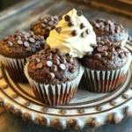 - 1 cup all-purpose flour - 1/2 cup granulated sugar - 1/2 teaspoon baking powder - 1/4 teaspoon baking soda - 1/4 teaspoon salt - 1/2 cup unsweetened cocoa powder - 1/2 cup brewed coffee, cooled - 1/4 cup vegetable oil - 1 large egg - 1 teaspoon vanilla extract - 1/2 cup chocolate chips (dark or semi-sweet) - 1/4 cup whipped coffee (made from instant coffee, sugar, and water) The ingredients for whipped coffee chocolate chip muffins are simple yet magical. The dry mix starts with all-purpose flour, which gives these muffins their structure. I add granulated sugar for sweetness and cocoa powder for that rich chocolate flavor. Baking powder and baking soda help the muffins rise, while salt balances the sweetness. Next, I move on to the wet ingredients. Brewed coffee, cooled, adds depth and flavor. I mix it with vegetable oil for moisture, an egg for richness, and vanilla extract for warmth. For a delightful twist, I fold in chocolate chips. You can use dark or semi-sweet, depending on your taste. The whipped coffee topping is optional but adds a fun, creamy finish. It’s made from instant coffee, sugar, and water, whipped to airy perfection. These ingredients work together to create a muffin that is not just delicious but also a treat to share. Each bite combines the warmth of coffee and the sweetness of chocolate, making them an irresistible delight. 1. Preheat the Oven: Start by setting your oven to 350°F (175°C). This ensures even baking. 2. Prepare the Muffin Tin: Line a muffin tin with paper or silicone liners. This makes for easy removal later. 1. Combine Dry Ingredients: In a large bowl, whisk together the following: - 1 cup all-purpose flour - 1/2 cup granulated sugar - 1/2 teaspoon baking powder - 1/4 teaspoon baking soda - 1/4 teaspoon salt - 1/2 cup unsweetened cocoa powder Mix well until everything is evenly blended. 2. Combine Wet Ingredients: In another bowl, stir together: - 1/2 cup brewed coffee, cooled - 1/4 cup vegetable oil - 1 large egg - 1 teaspoon vanilla extract Mix until the mixture is smooth. 3. Mix the Two Mixtures: Pour the wet mixture into the dry ingredients. Stir gently until just combined. It's okay if there are a few lumps. 1. Fold in Chocolate Chips: Add 1/2 cup of chocolate chips to the batter. Gently fold them in, saving a few for the top. 2. Fill Muffin Tin: Spoon the batter into the prepared muffin tin. Fill each cup about 2/3 full to allow for rising. 3. Add Whipped Coffee: Top each muffin with a dollop of whipped coffee. Use the back of a spoon to spread it gently. Sprinkle the reserved chocolate chips on top for extra flavor. 4. Baking Process: Place the muffin tin in the oven and bake for 18-20 minutes. Check doneness by inserting a toothpick in the center. It should come out clean. Now, you have a delightful treat ready to enjoy! To make great muffins, avoid overmixing. When you mix the wet and dry ingredients, stir gently. A few lumps in the batter is okay. This keeps the muffins light and fluffy. Using cooled coffee is key. Hot coffee can cook the egg and change the texture. Brew your coffee ahead and let it cool before using it in the mix. To boost flavor, try adding spices like cinnamon or nutmeg. These spices can add warmth and depth to your muffins. You can also play with chocolate chips. Dark or semi-sweet chips work well. If you want, try white chocolate or even peanut butter chips for a twist. Serve these muffins warm on a pretty plate. Dust them with powdered sugar for a sweet touch. You can also add a side of whipped cream. This adds a creamy element that pairs well with the muffins. For a fun garnish, place a chocolate chip on top of the whipped coffee. This makes each muffin look even more inviting. {{image_2}} You can easily make these muffins fit your diet. For gluten-free options, use a gluten-free flour blend. This will keep the texture light and fluffy. When using gluten-free flour, measure carefully for the best results. If you want vegan muffins, replace the egg with a flax egg. To make a flax egg, mix one tablespoon of ground flaxseed with three tablespoons of water. Let it sit for five minutes. Also, use a plant-based oil, like coconut or canola oil. You can swap the milk for almond or oat milk too. Get creative with flavors! Adding nuts, like walnuts or pecans, gives a nice crunch. Chopped fruits, like bananas or berries, can add sweetness and moisture. You can also try using different coffee flavors. For a stronger taste, use espresso in place of brewed coffee. This will give your muffins a richer coffee flavor that pairs well with chocolate. Want smaller bites? Make mini muffins instead of standard ones. This way, you can enjoy more without feeling too full. Just fill the mini muffin tin about halfway. Bake for around 12-15 minutes. Always check with a toothpick to see if they are done. If you prefer standard muffins, follow the original recipe. Adjust the baking time to 18-20 minutes. Each method offers a fun way to enjoy these tasty treats! To keep your muffins fresh, store them in an airtight container. This helps prevent them from drying out. You can also wrap them in plastic wrap before placing them in the container. For extra care, add a slice of bread in the container. This slice will help maintain moisture. Try to store your muffins at room temperature. Avoid placing them in the fridge, as it can make them stale faster. Freezing muffins is simple and effective. First, let the muffins cool completely. Then, wrap each muffin in plastic wrap. Place the wrapped muffins in a freezer bag, removing as much air as possible. This will help prevent freezer burn. When you're ready to enjoy a muffin, take it out and let it thaw at room temperature. You can also warm it in the microwave for about 15 seconds for a fresh taste. When stored correctly, these muffins can last up to 3 days at room temperature. If you choose to freeze them, they can last for about 3 months. Always check for signs of spoilage. If you see mold or if they smell off, it’s best to throw them away. Enjoy your Whipped Coffee Chocolate Chip Muffins while they are fresh for the best taste! What is whipped coffee and how is it made? Whipped coffee, also known as Dalgona coffee, is a frothy coffee drink. To make it, mix equal parts instant coffee, sugar, and hot water. Use a whisk or mixer to beat it until it becomes thick and creamy. It's a fun topping for many desserts, including these muffins. Can I substitute ingredients in this recipe? Yes, you can! For the flour, you can use a gluten-free blend. You can also swap the sugar for a natural sweetener, like honey or maple syrup. If you need dairy-free options, use almond milk instead of regular milk. How do I know when muffins are done? Muffins are done when a toothpick inserted into the center comes out clean. You may also see a golden-brown top. If the toothpick has batter on it, give them a few more minutes in the oven. Can I use instant coffee instead of brewed coffee? Yes, you can use instant coffee. Just mix it with hot water to dissolve it before adding to your wet ingredients. This will give your muffins a nice coffee flavor. What drinks pair well with these muffins? These muffins pair well with a hot cup of coffee or a creamy latte. A glass of cold milk also balances the rich chocolate flavors. For a fruity twist, try a berry smoothie. Can I serve these muffins for breakfast or dessert? You can serve these muffins for both! They are great as a sweet breakfast treat or a dessert. Add a scoop of ice cream on top for a fun dessert option. You've learned how to make tasty muffins with clear steps and helpful tips. We covered dry and wet ingredients, mixing them just right, and how to personalize your muffins. Remember, cool coffee is key, and don’t overmix for perfect results. Enjoy your creation for breakfast or a snack. Whether you freeze them or serve them fresh, these muffins are a delicious treat you’ll love sharing. Now get baking and enjoy your sweet success!